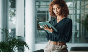 Someone holding a tablet.